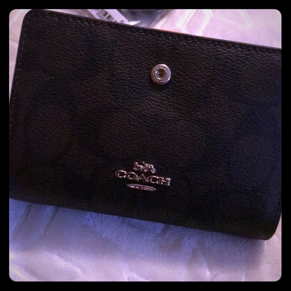 Guaranteed Authentic Coach wallet with coin slot.